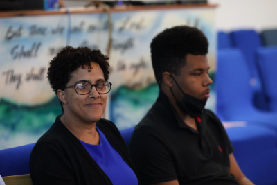 Woman and Young man enjoying church service