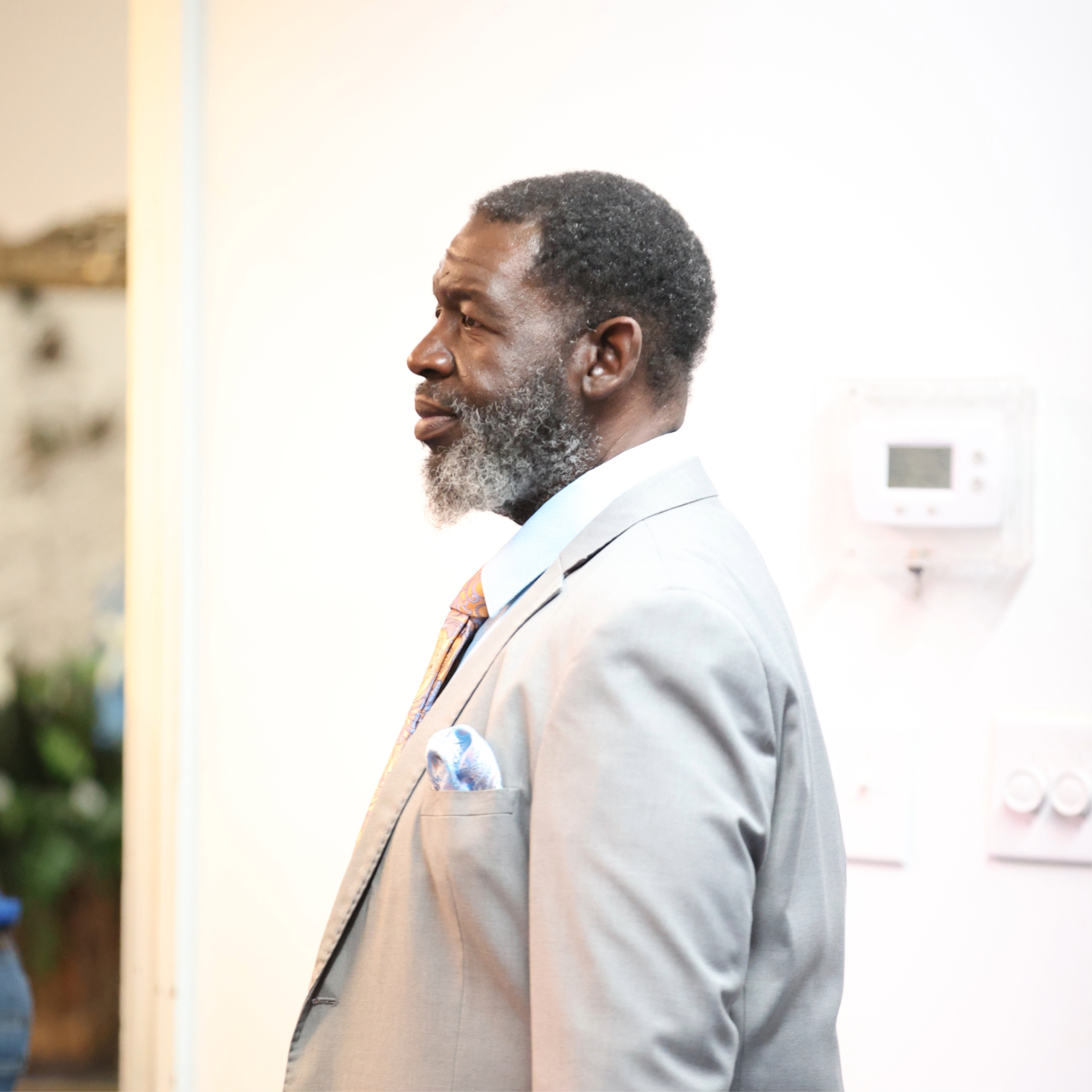 Woman with eyes closed listening to the Pastor